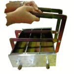 Concrete Shrinkage Mould Lifting Device in use